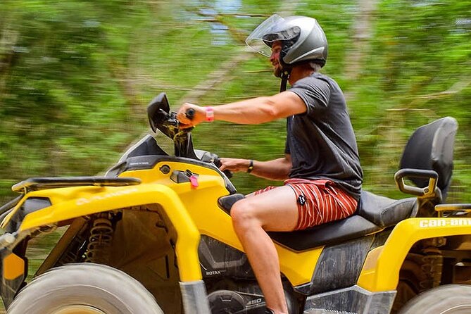 Adrenaline Tour from Cancún, ATV, Zipline, Cenote and Lunch - Riding an ATV through rugged jungle trails