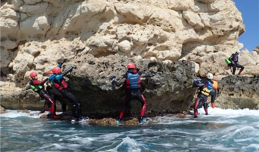 Alicante: Coasteering Adventure on Torres de la Villajoyosa - Swimming beside the cliffs and through the caves