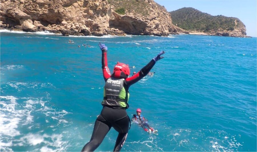 Alicante: Coasteering Adventure on Torres de la Villajoyosa - Climbing over the rocky shore