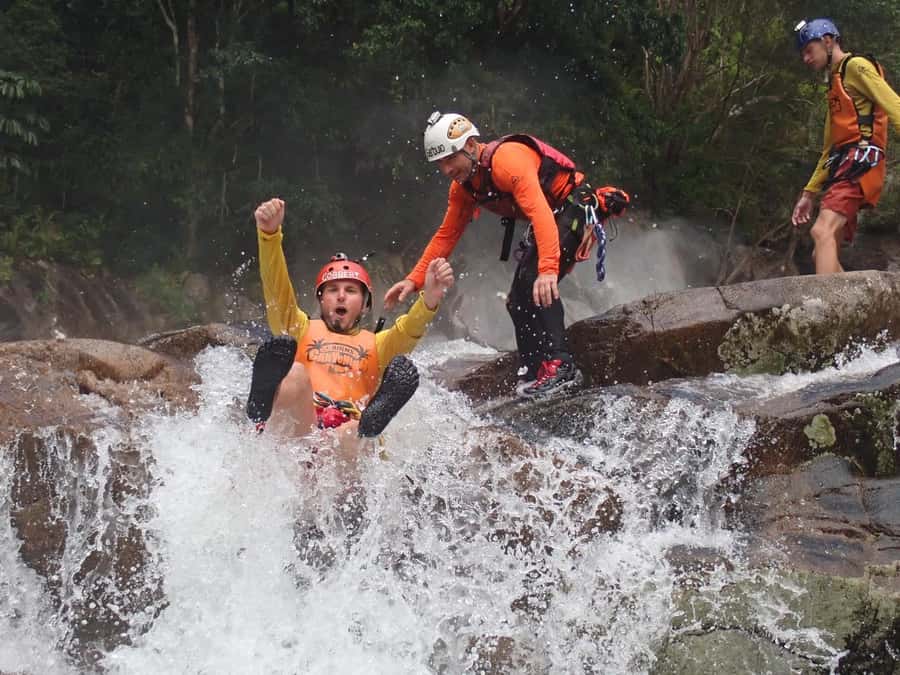 Cairns: Behana Gorge Rainforest Canyoning Tour - Waterfalls, rock slides, and natural pools