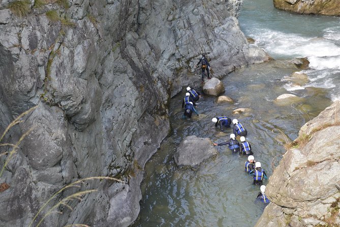 Canyoning Experience in Sorba River - Getting ready with a helmet, harness, and wetsuit