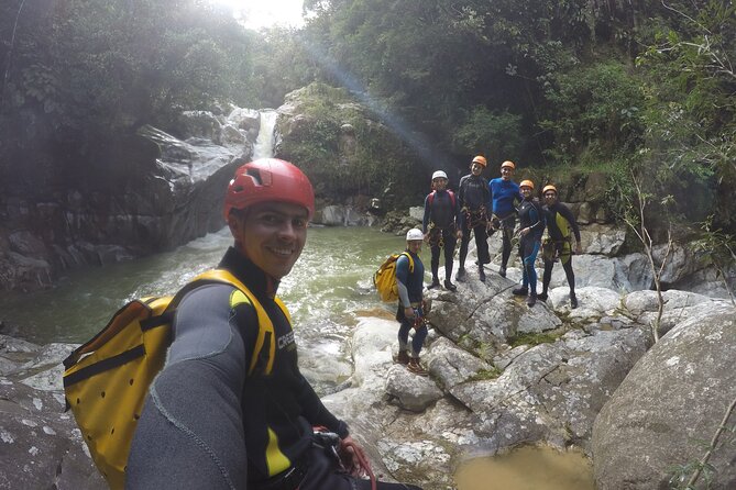 Canyoning Guatape River - Gearing up with helmets, harnesses, and neoprene