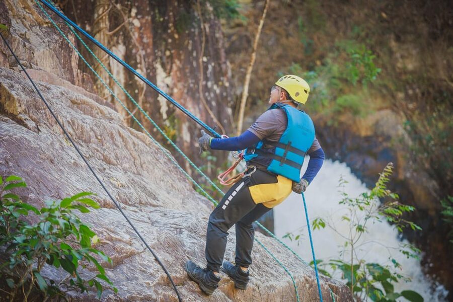 Canyoning Tour in Da Lat - The first 18-meter rappel beside a waterfall