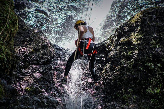 Combo Arenal Rafting and Canyoning Adventure - Rappelling through waterfalls and rainforest rock