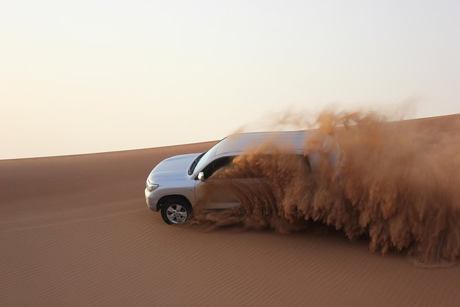 Dubai Red Dune Extreme Desert Safari Adventure With Sand Boarding - Sandboarding from the high dune