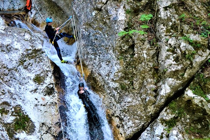 Dynamic Adventure Canyoning in Bovec with Free Photos and Videos - The 12-meter waterfall rappel