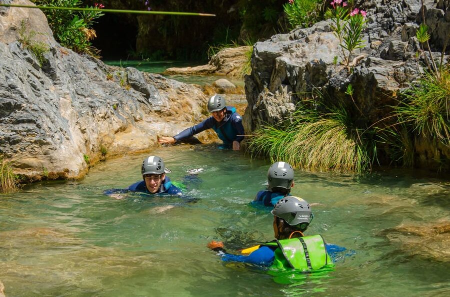 From Granada: Rio Verde Canyoning Tour with Lunch - Three hours of slides, jumps, swims, and rappels