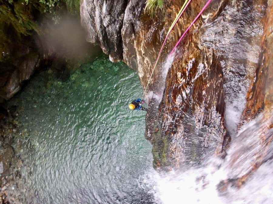 From Queenstown: Mount Aspiring Full-Day Canyoning Adventure - Jumps, abseils, swims, and slides