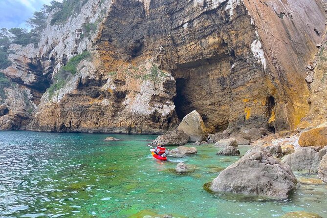 Kayak Paradise: Cala Portixol Snorkel, Cave & Cliff Jumping Tour - Exploring Portixol’s caves and natural pool