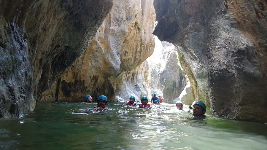 Marbella: Beginner Canyoning Tour with Safety Equipment - Walking into the canyon and along the clear river