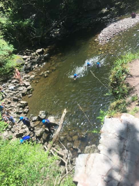 Neath: Canyoning, Gorge Walking & Waterfall Trekking Tour - Natural rock slides and controlled challenges