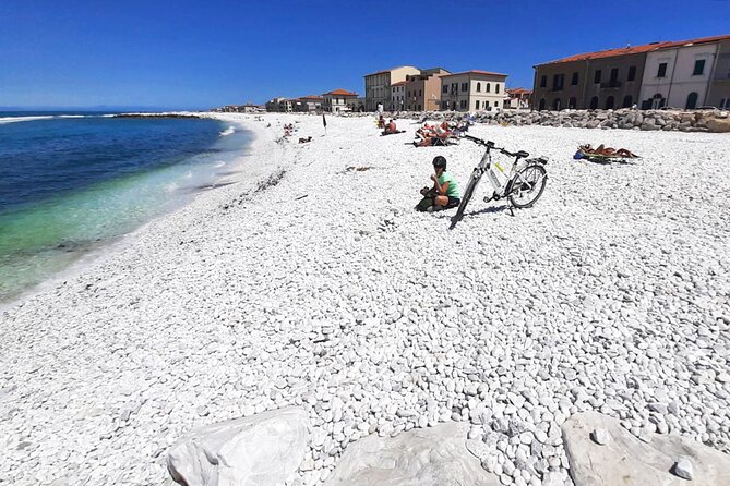 Pisa to the Sea Self-Guided Bike Tour & Adventure Park - Marina di Pisa: harbor views, fishing nets, and a swim
