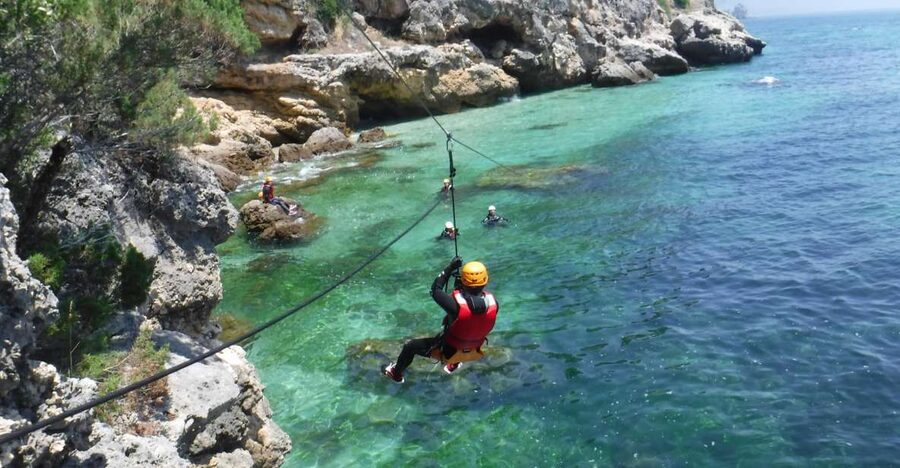 Portinho da Arrábida: Coasteering Boat Tour - Portinho da Arrábida turns the coast into an adventure course