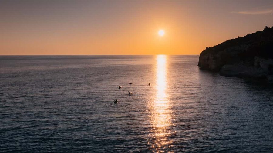 Pula:Sunset Tour By Clear Kayak,Cave,Swim & Cliff Jumping - The return paddle under changing light