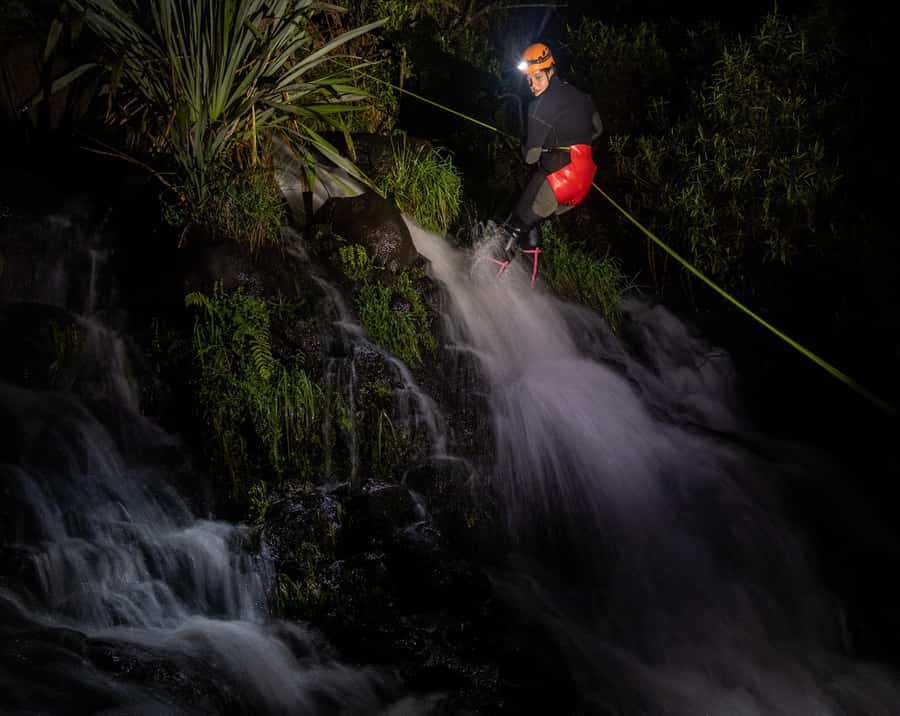 Raglan: Sunset Canyoning Tour and Glowworm Experience - Warm wetsuits, cold water, and the first descent