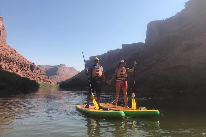 Rappelling and Stand Up Paddleboarding Combo - Rappelling beside a natural arch