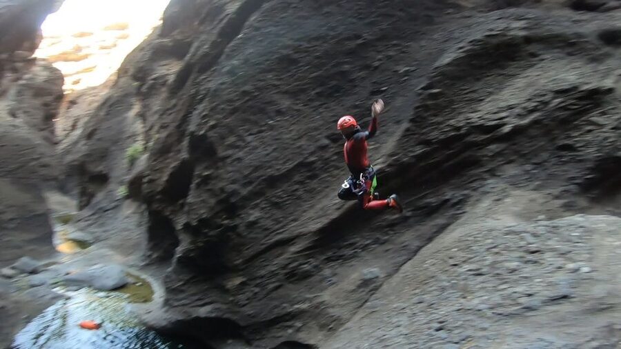 Tenerife: Guided Canyoning Experience - Rappelling down the first rock walls