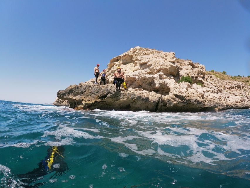 Valencia: Coasteering Adventure in Cullera Lighthouse - Cliff jumps, natural chutes, and rock obstacles